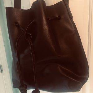 Black man-made leather bucket bag NWOT